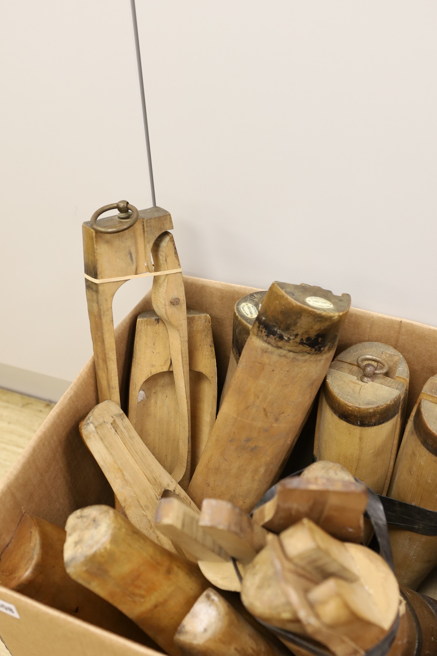 An assortment of beech boot-trees and folding boot hooks